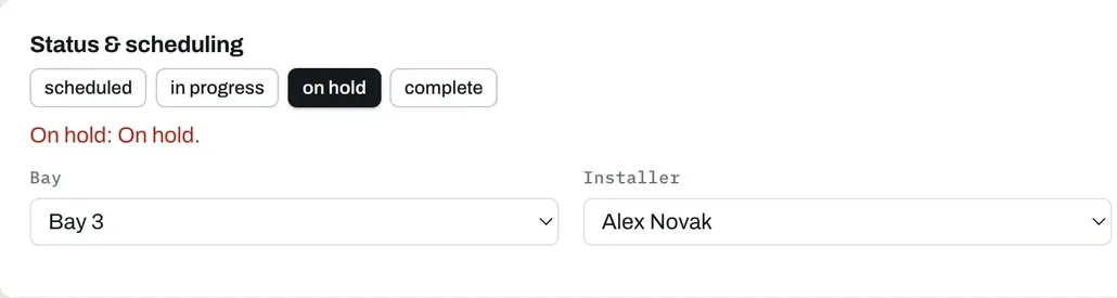 A wrap job's status row showing the job status, the assigned bay and the assigned installer. Sample data.